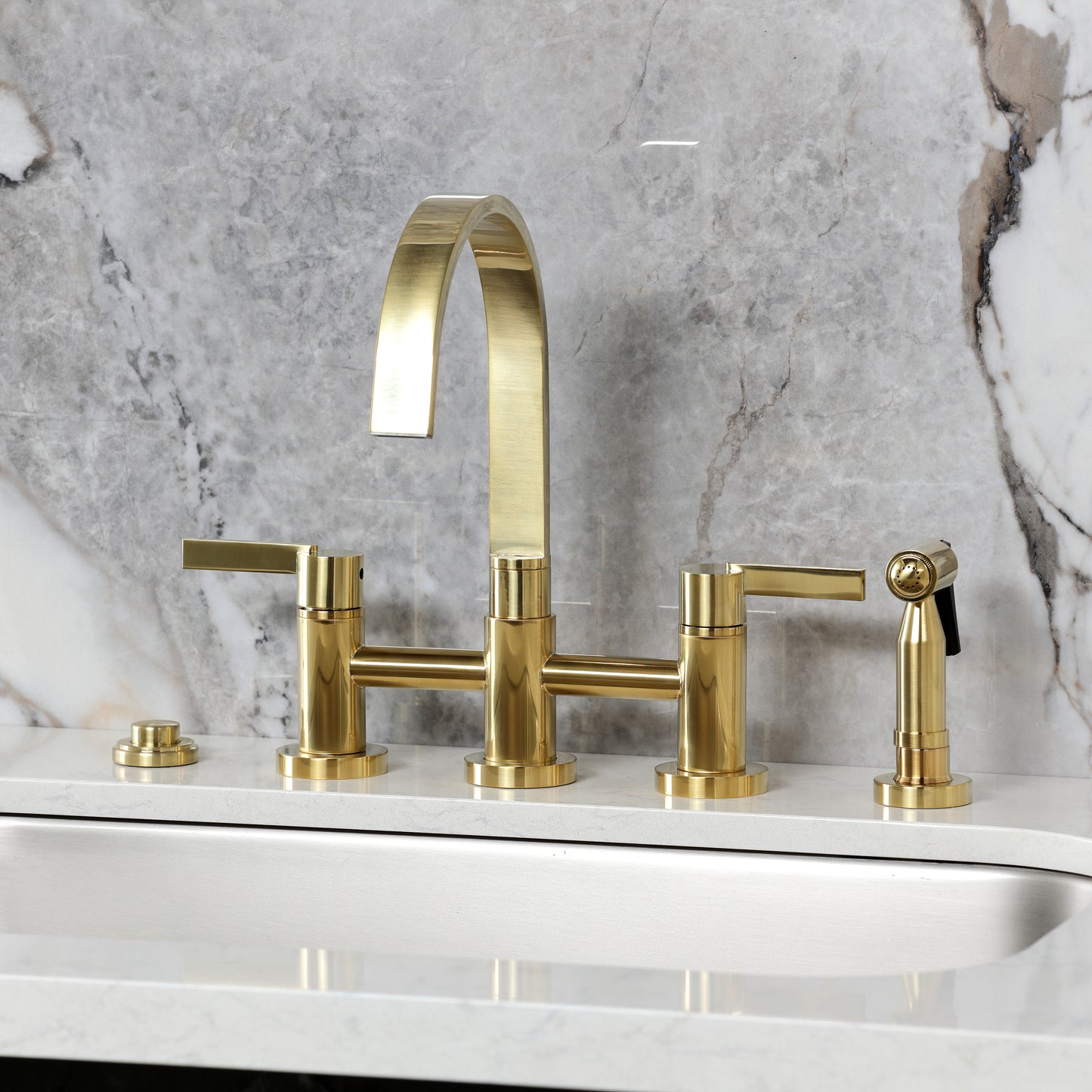 Kingston KS8267CTLBS Continental Bridge Kitchen Faucet with Brass Sprayer, Brushed Brass on marble countertop