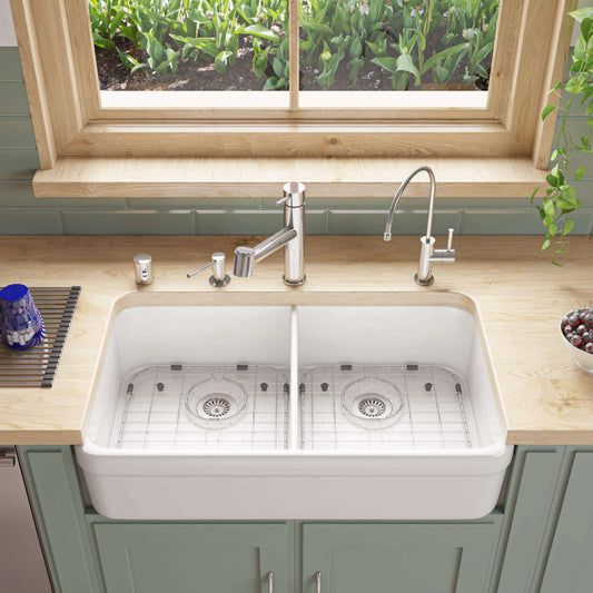ALFI brand AB512 32" Double Bowl Fireclay Farmhouse Sink in a beautifully designed kitchen setting with modern faucet.
