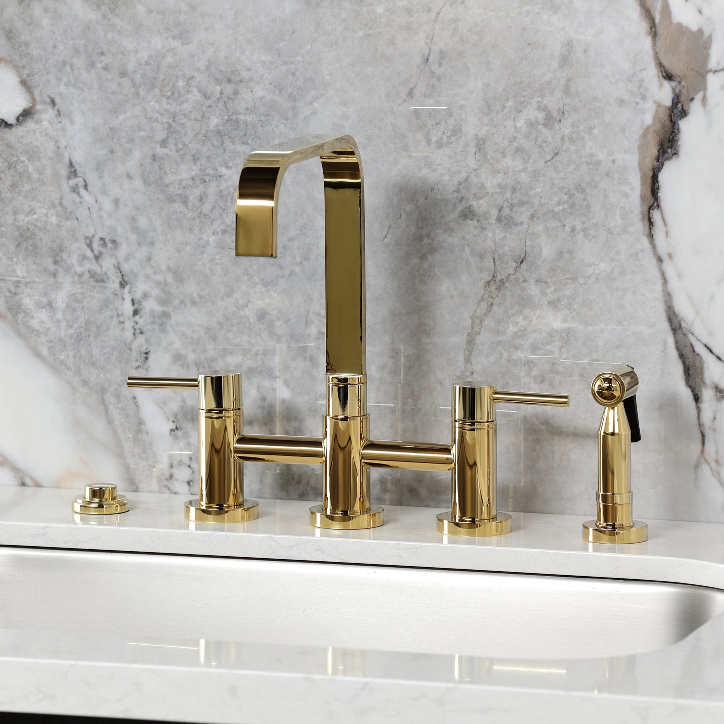 Kingston KS8257DLBS Concord Bridge Kitchen Faucet with Brass Sprayer, Brushed Brass mounted on marble countertop