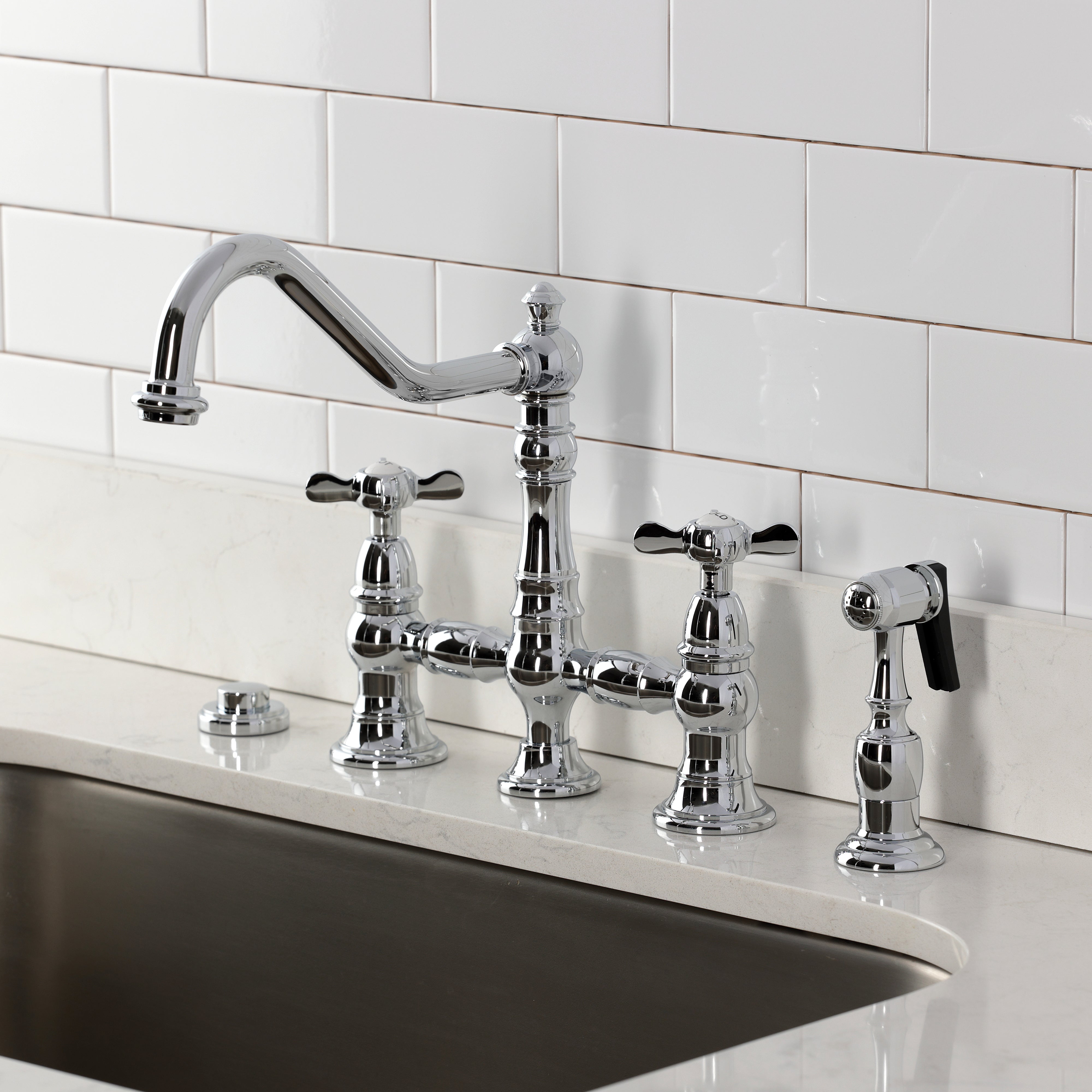 Kingston KS3277BEXBS Essex Bridge Kitchen Faucet with Brass Sprayer, Brushed Brass installed in a kitchen.