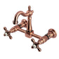 Kingston KS2443AX Heritage Two-Handle Wall Mount Bridge Kitchen Faucet, Antique Brass with swivel Victorian spout.