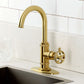 Kingston Brass KSD8503RKZ Wendell Single-Handle Bar Faucet with Knurled Handle, Antique Brass in a sleek kitchen.