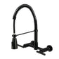 Kingston Brass GS8287CML Manhattan Double-Handle Wall-Mount Pre-Rinse Bridge Kitchen Faucet, Brushed Brass in matte black finish.
