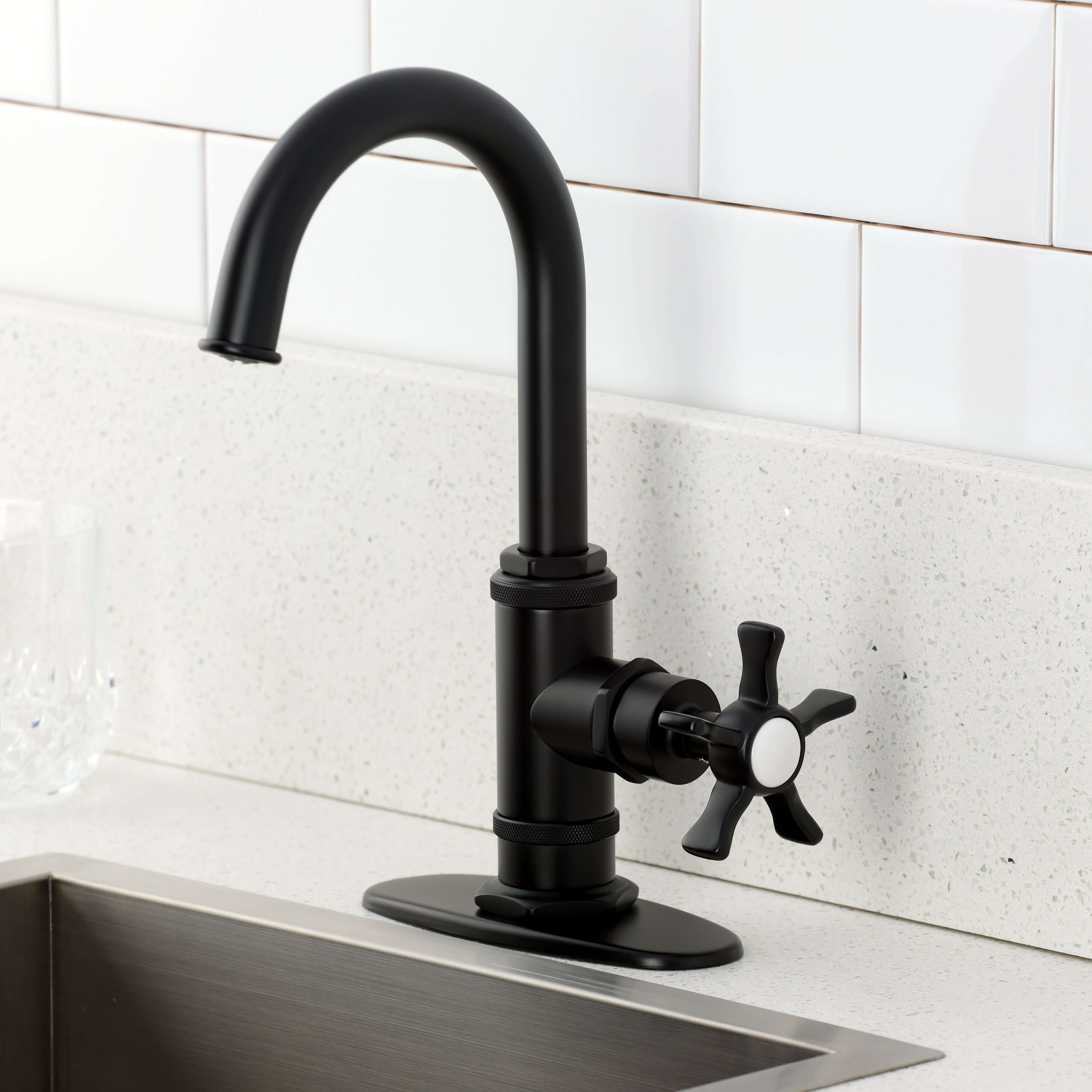 Kingston Brass KSD8503NX Hamilton Single-Handle Bar Faucet, Antique Brass on a modern kitchen countertop.