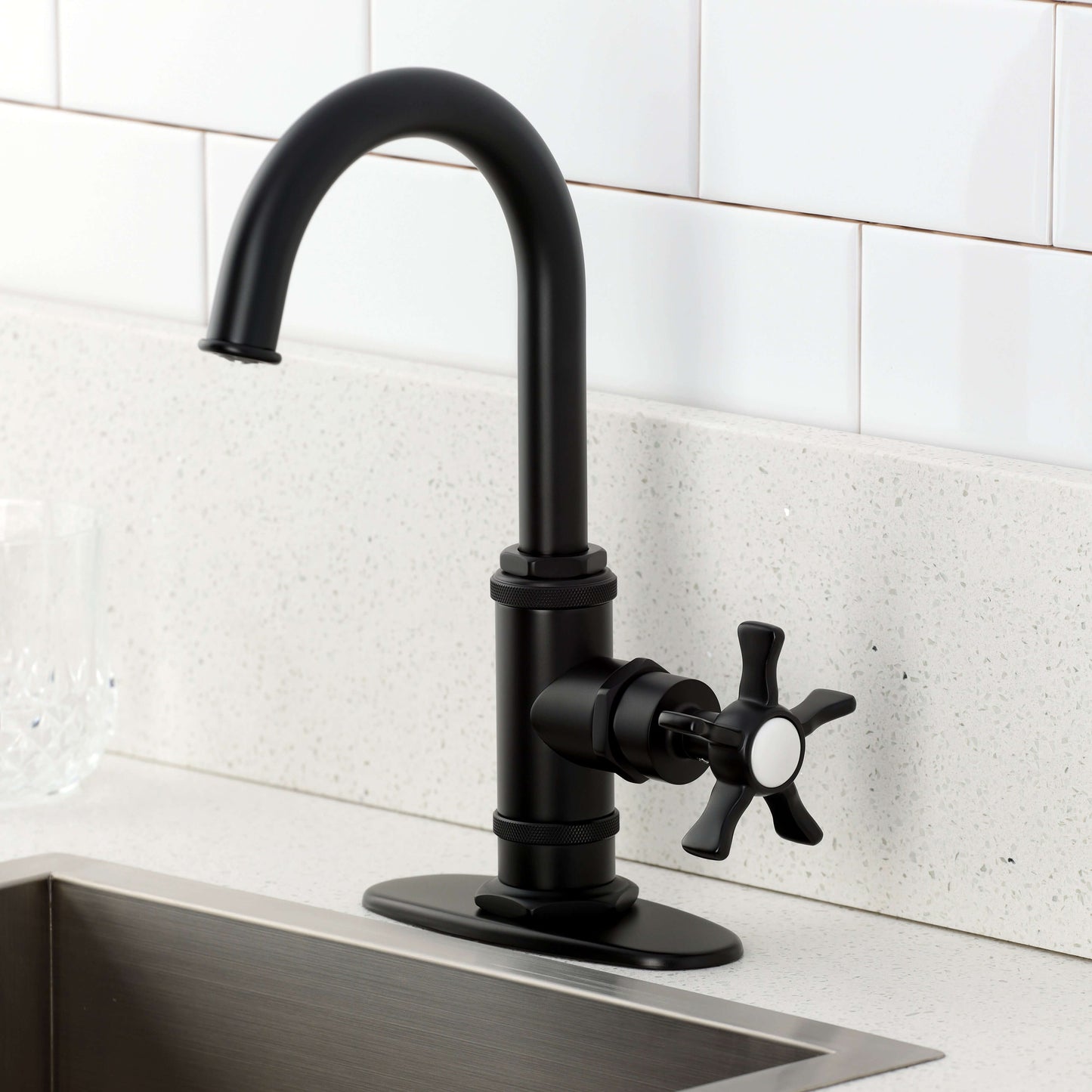 Kingston Brass KSD8503NX Hamilton Single-Handle Bar Faucet, Antique Brass on a modern kitchen countertop.