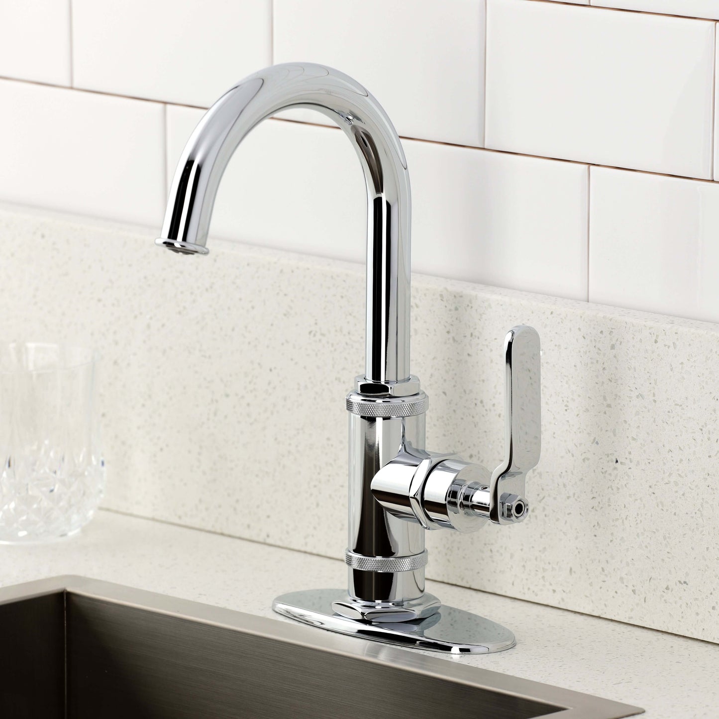 Kingston Brass KSD8503KL Whitaker Single-Handle Bar Faucet, Antique Brass in a modern kitchen setting.