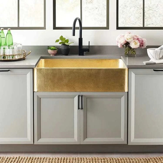 Thompson Quiroga 33" Hammered Semi-Satin Brass Farmhouse Kitchen Sink - KSA-3322HPB installed in modern kitchen.