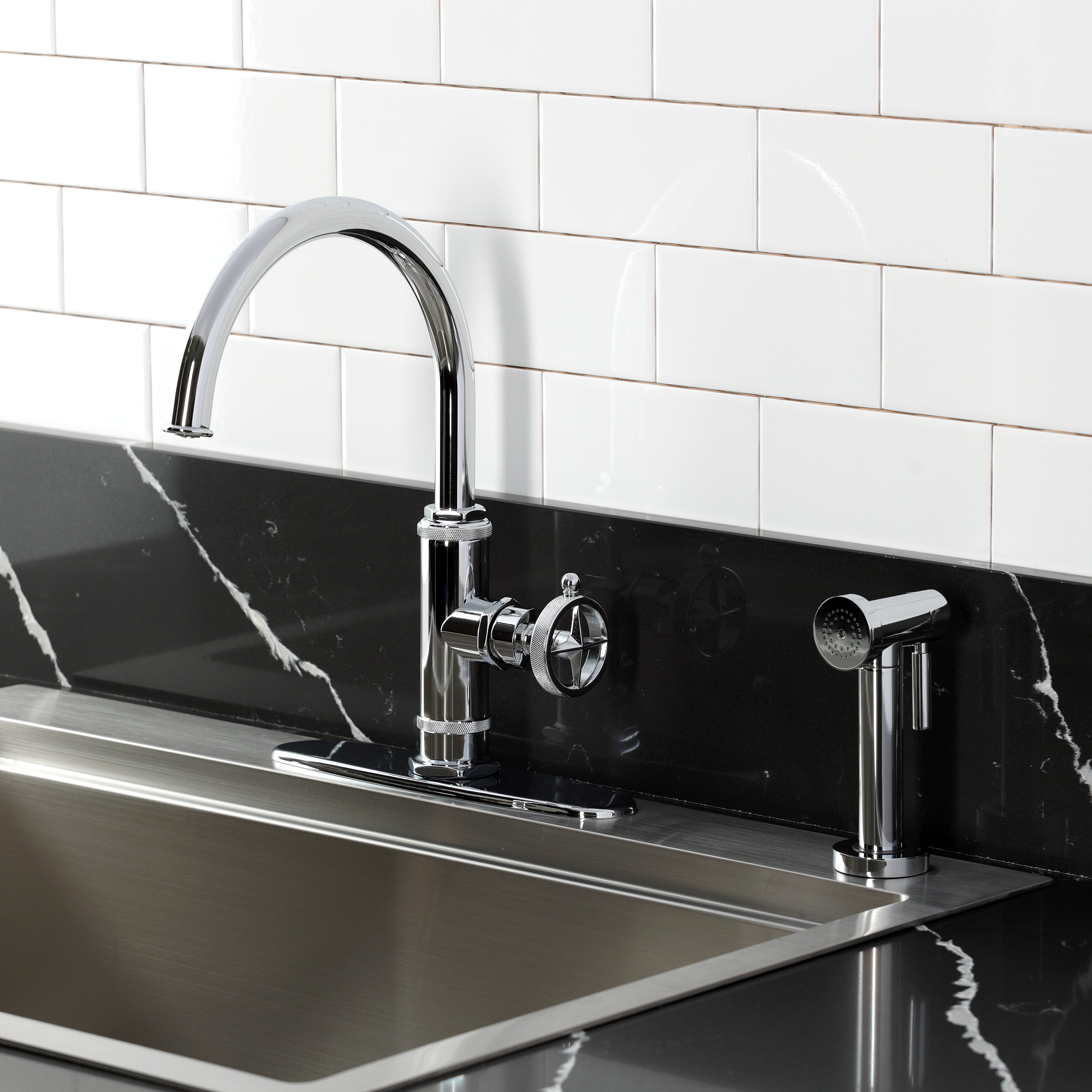Kingston Brass KSD2433RNK Levante Single-Handle Kitchen Faucet, Antique Brass with side spray in a modern kitchen setting.