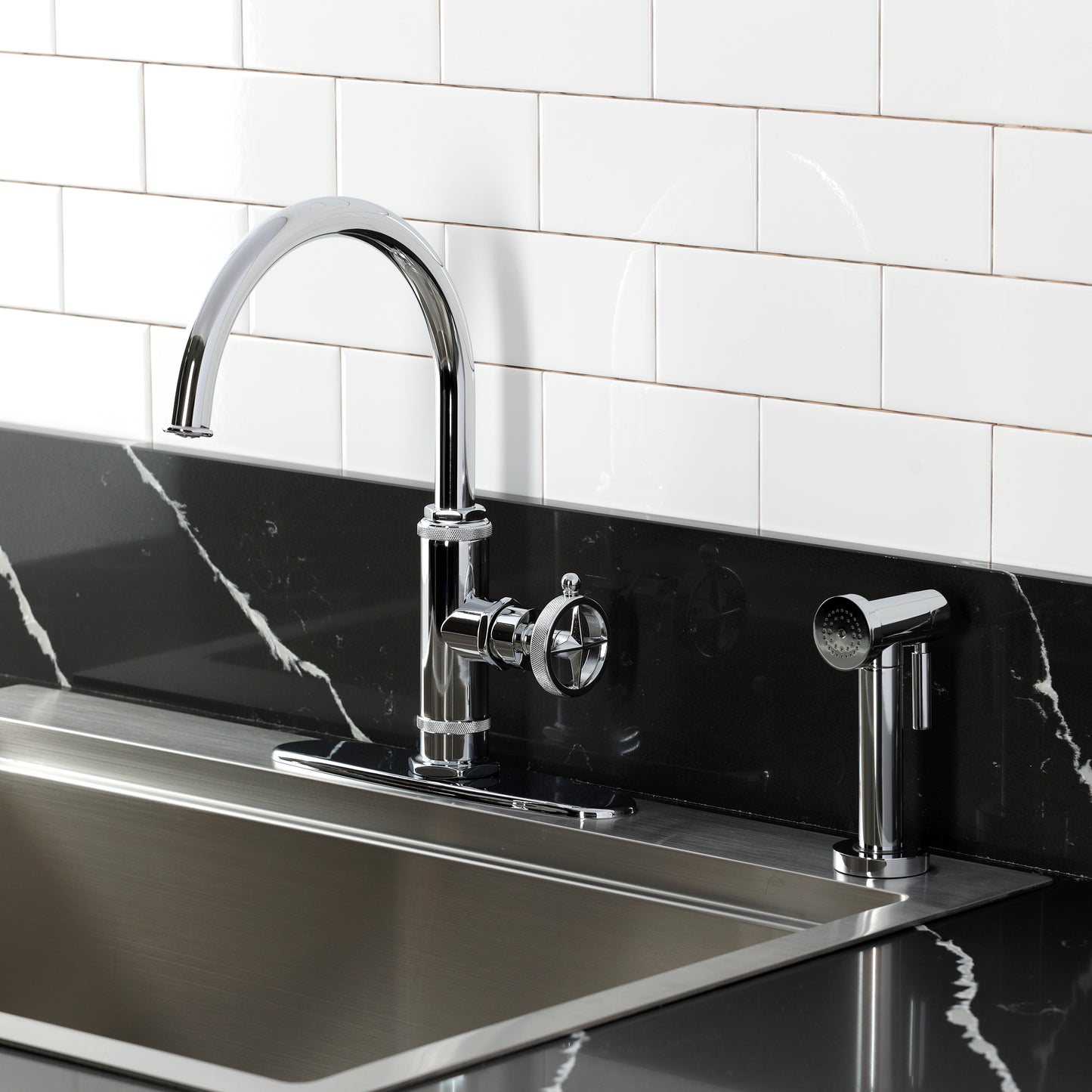 Kingston Brass KSD2433RNK Levante Single-Handle Kitchen Faucet, Antique Brass with side spray in a modern kitchen setting.