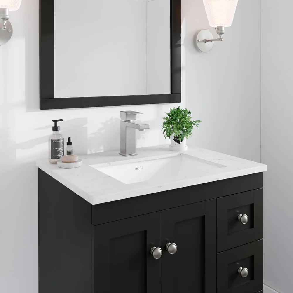 Top angle of Eviva Acclaim single sink vanity in Espresso showing Carrara Quartz top detail, brushed nickel knobs and undermount sink