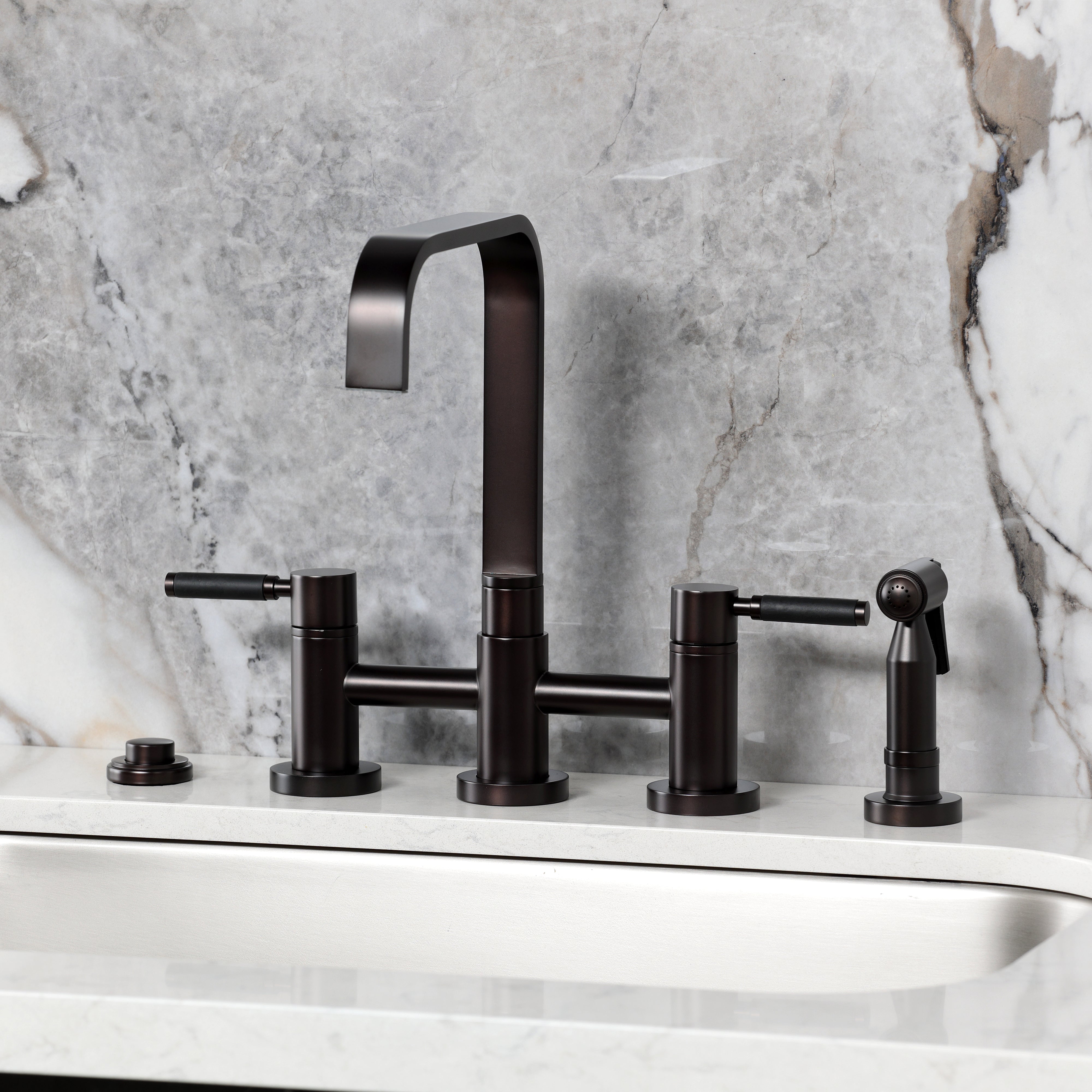 Kingston KS8257DKLBS Kaiser Bridge Kitchen Faucet with Brass Sprayer, Brushed Brass on marble countertop