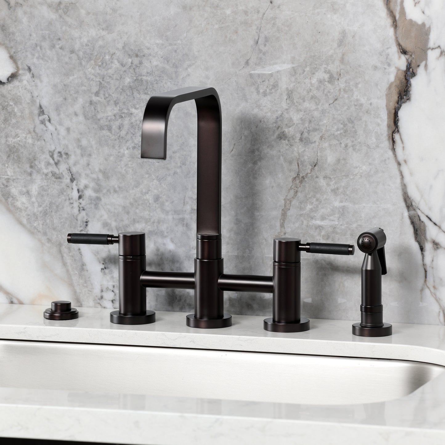 Kingston KS8257DKLBS Kaiser Bridge Kitchen Faucet with Brass Sprayer, Brushed Brass on marble countertop