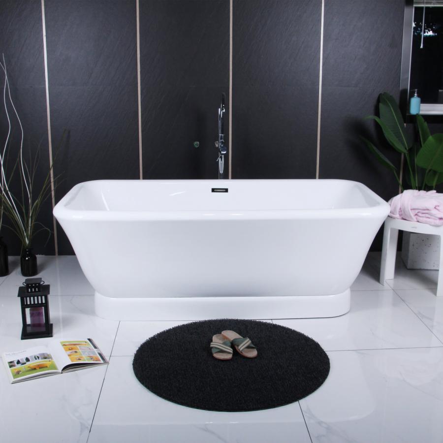 Lifestyle image of Aqua Eden freestanding pedestal bathtub in a serene bathroom setting