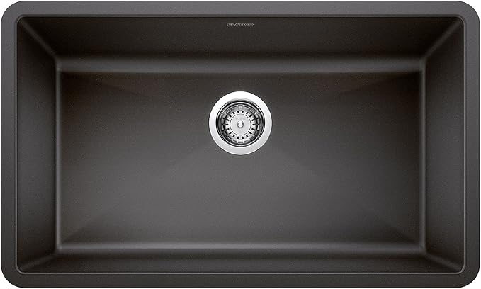 Blanco Silgranit Super Single 32"  kitchen sink in Coal Black with silver drain cover on a black background