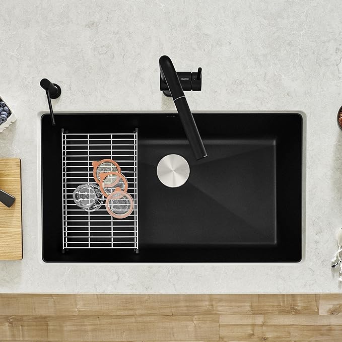 Blanco Silgranit Super Single 32"  kitchen sink in Coal Black with a matching faucet on a light gray countertop.