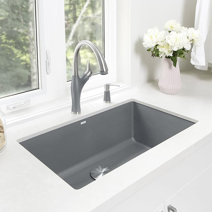 Blanco Silgranit Super Single 32"  kitchen sink in Metallic Gray with gray faucet in a bright kitchen setting