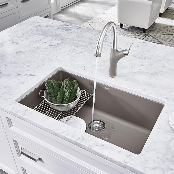 Blanco Silgranit Super Single 32"  kitchen sink in Truffle with running water on a marble countertop
