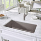 Blanco Silgranit Super Single 32"  kitchen sink in Truffle with matching faucet on a marble countertop in a modern kitchen setting.