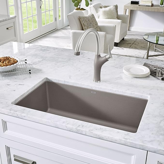 Blanco Silgranit Super Single 32"  kitchen sink in Truffle with matching faucet on a marble countertop in a modern kitchen setting.