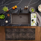 Blanco Silgranit Super Single 32"  kitchen sink in Volcano Gray with various items on a dark marble countertop