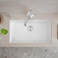 White Blanco Precis 32" Silgranit kitchen sink with faucet on a beige countertop