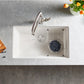 Blanco Silgranit 32inch white kitchen sink with silver faucet on a gray countertop with blueberries