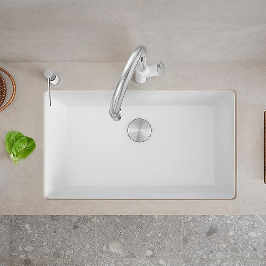 White Blanco Precis 32" Silgranit kitchen sink with faucet on a beige countertop