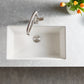 White Blanco Precis 32" Silgranit kitchen sink with silver faucet on a gray countertop