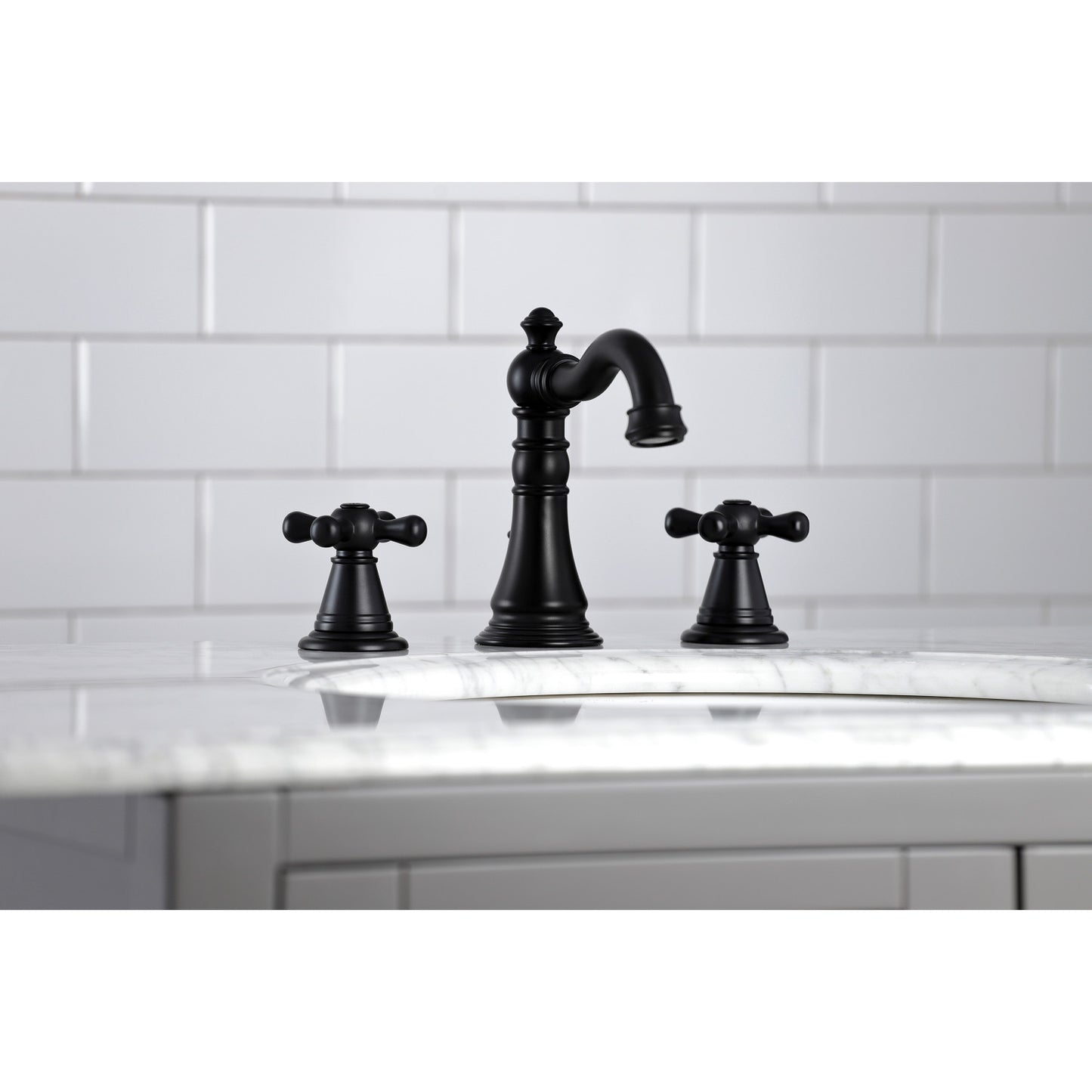 KINGSTON Brass Widespread Bathroom Faucet with Pop-Up Drain - FSC1979AAX in elegant black finish, top-down view on marble countertop.