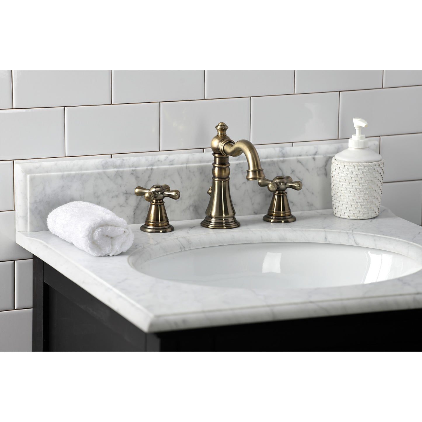KINGSTON Brass Widespread Bathroom Faucet with Pop-Up Drain - FSC1979AAX top view showcasing Victorian design on marble countertop.