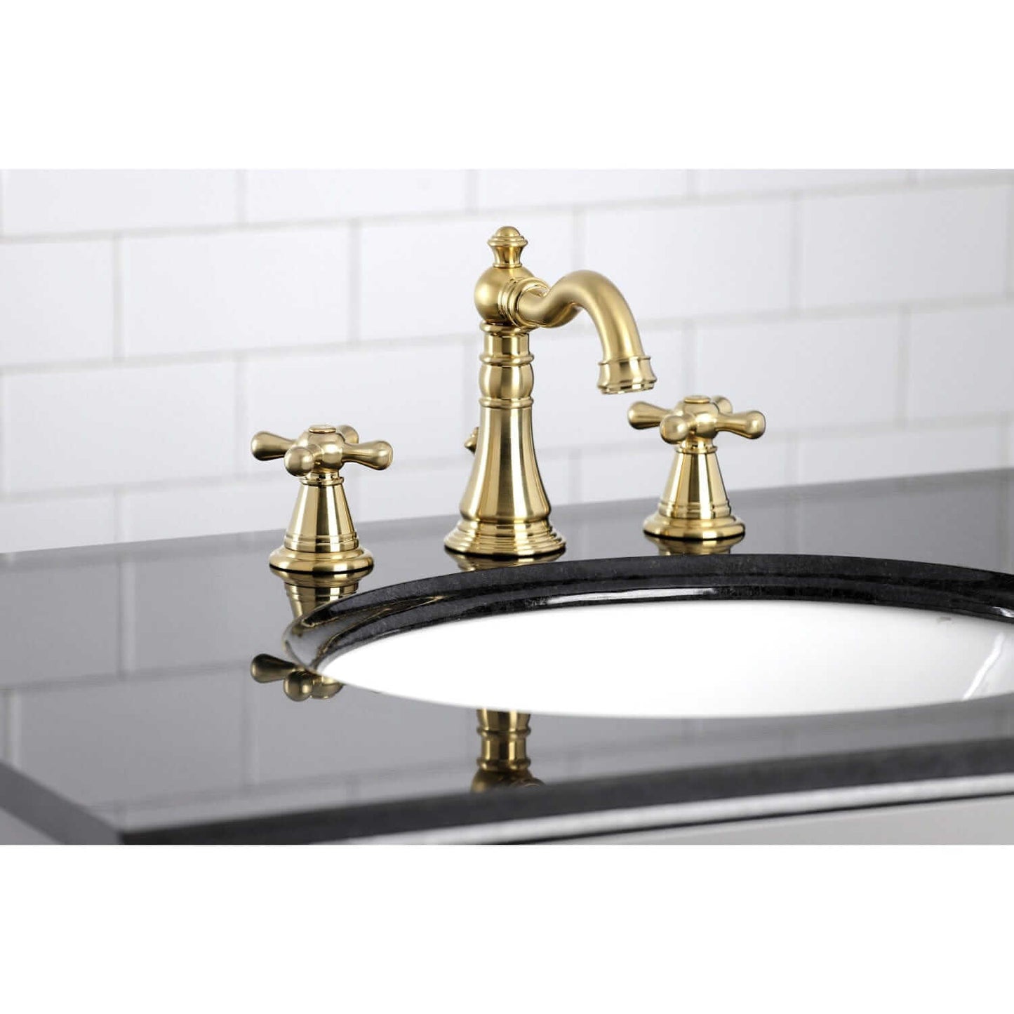 KINGSTON Brass Widespread Bathroom Faucet with Pop-Up Drain - FSC1979AAX on black countertop, showcasing Victorian design features.
