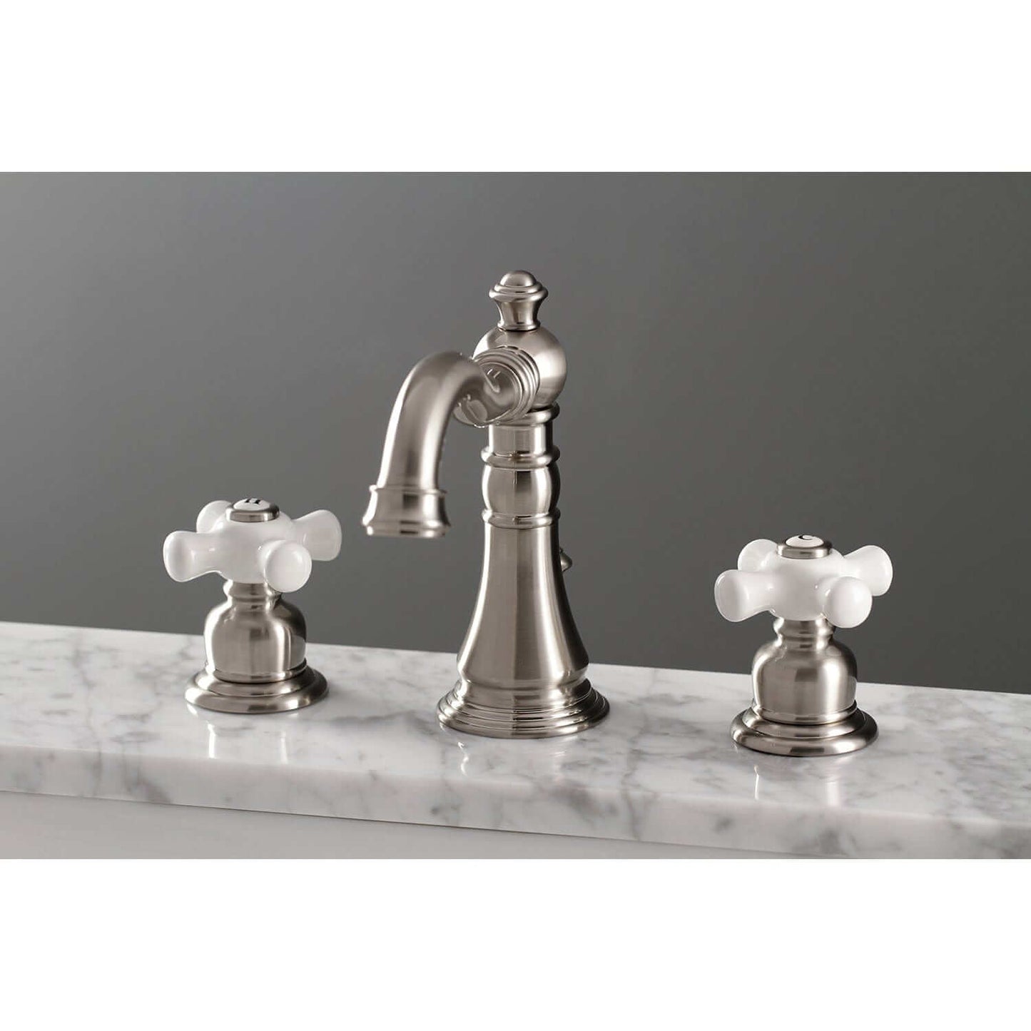 KINGSTON Brass American Classic Widespread Bathroom Faucet with white ceramic handles, top-down view on marble countertop.