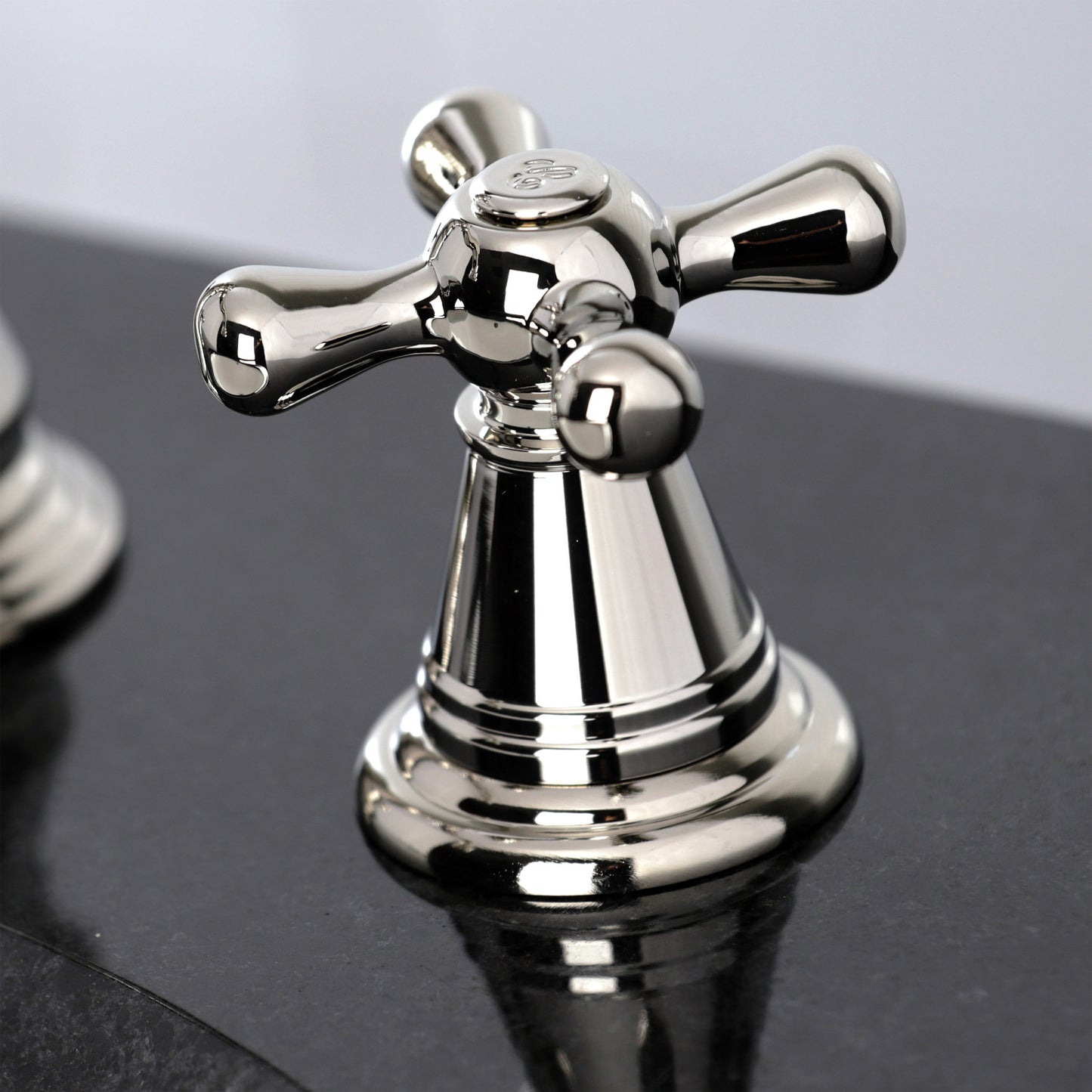 KINGSTON Brass Widespread Bathroom Faucet with Pop-Up Drain - FSC1979AAX close-up of cross handle on faucet