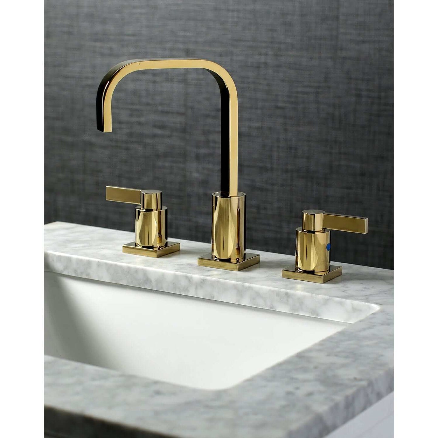 Left side view of KINGSTON Brass Fauceture NuvoFusion Widespread Bathroom Faucet on marble countertop.