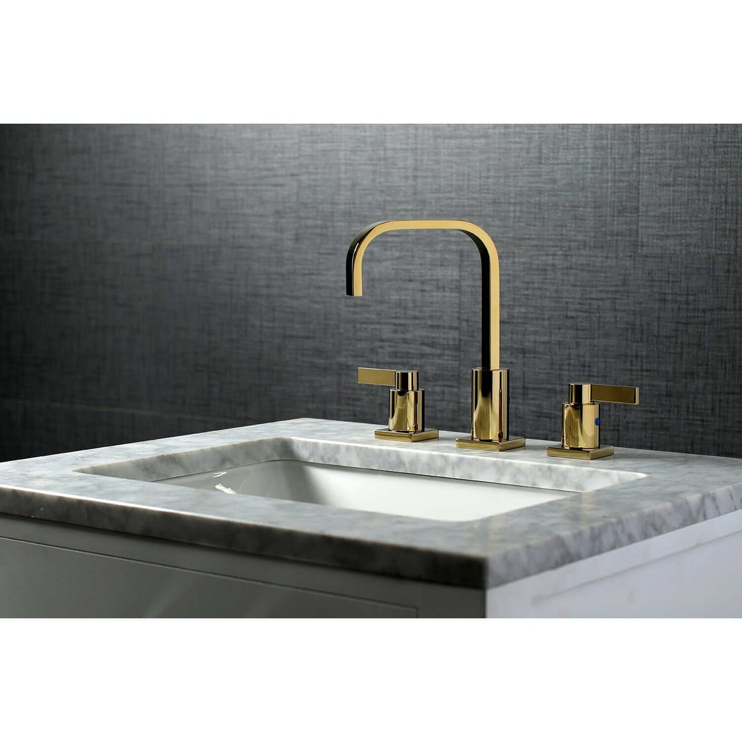 KINGSTON Brass Fauceture NuvoFusion Widespread Bathroom Faucet on marble countertop with gray background.