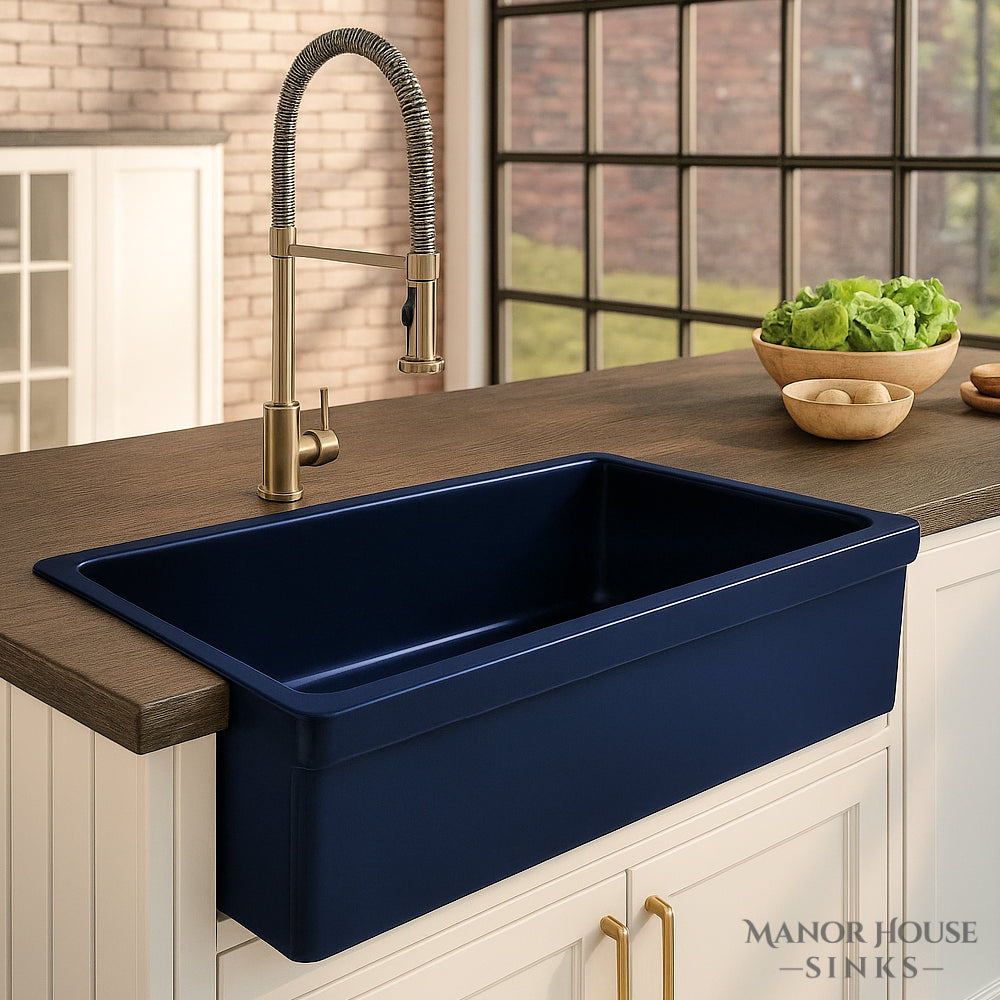 Blue Whitehaus farmhouse sink - WHQ530 with gold faucet in a kitchen setting