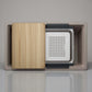 BLANCO Inteos kitchen sink with wooden cutting board and metallic components on a neutral background