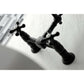Kingston Brass matte black double-handle 2-hole wall-mount bridge kitchen faucet on a white sink with blurred background