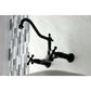 Kingston Brass matte black double-handle 2-hole wall-mount bridge kitchen faucet on a white wall with a tiled backsplash.