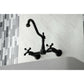 Kingston Brass matte black double-handle 2-hole wall-mount bridge kitchen faucet mounted on a white wall with a tiled backsplash
