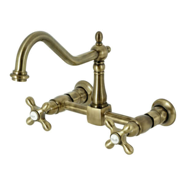 Vintage-style Kingston Brass antique brass double-handle 2-hole wall-mount bridge kitchen faucet on a white background