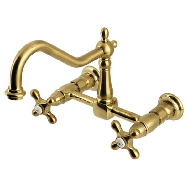 Kingston Brass brushed brass double-handle 2-hole wall-mount bridge kitchen faucet on a white background