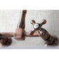 Kingston Brass double-handle 2-hole wall-mount bridge kitchen faucet in copper with a 'Cold' label on a white background