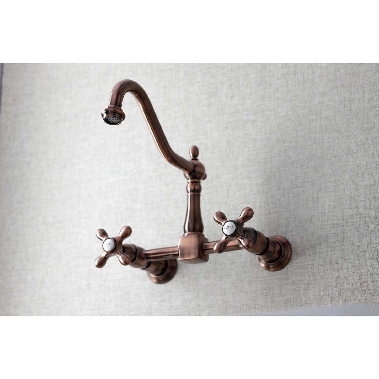 Kingston Brass antique copper double-handle 2-hole wall-mount bridge kitchen faucet wall-mounted kitchen faucet on a light gray background