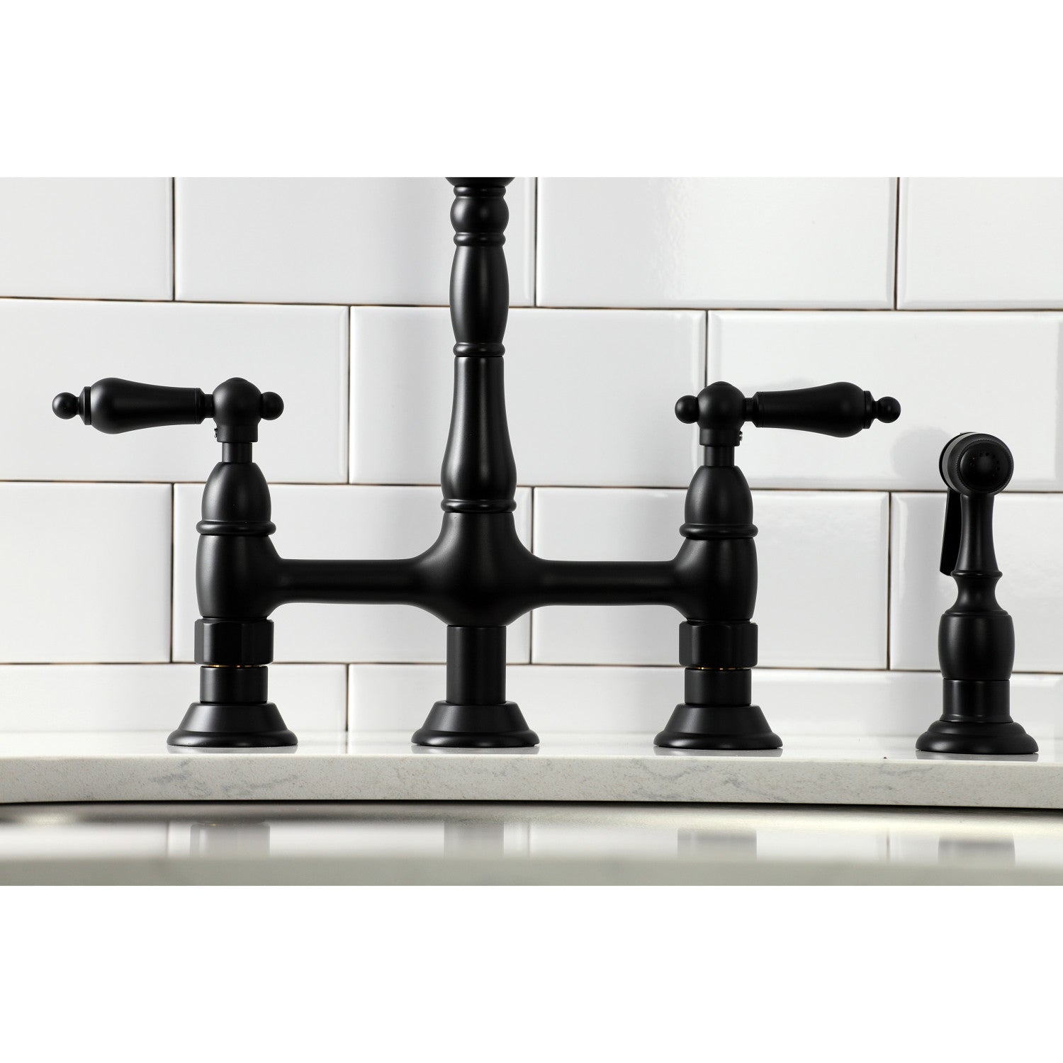Kingston Brass KS1270ALBS matte black kitchen bridge faucet set against a white tiled wall