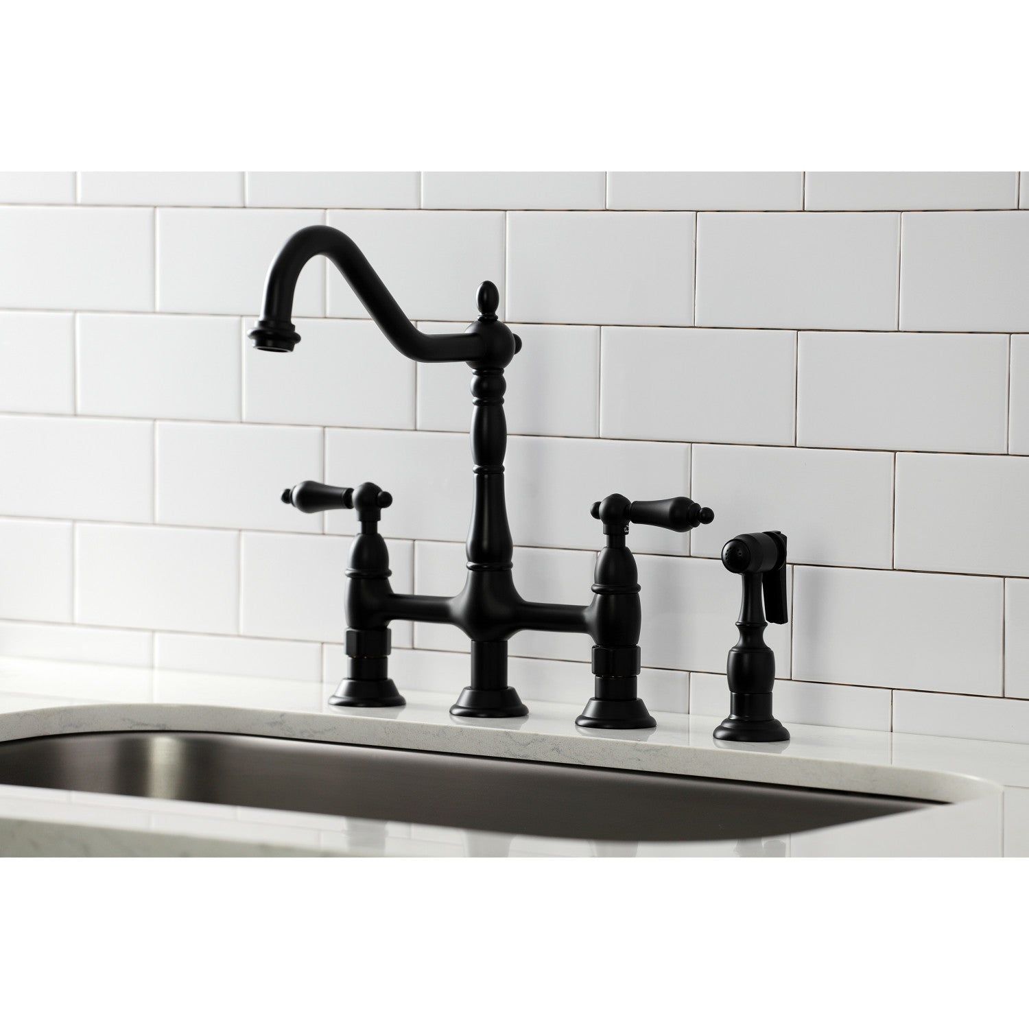 Kingston Brass KS1270ALBS matte black kitchen faucet with lever handles on a white tiled wall background