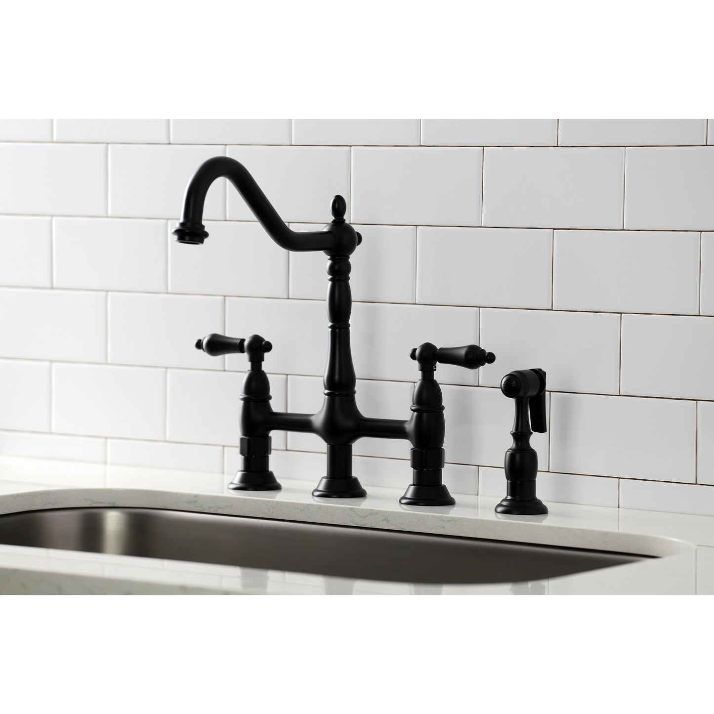 Kingston Brass KS1270ALBS matte black kitchen faucet with lever handles on a white tiled wall background