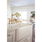 Farmhouse sink with a Kingston Brass KS1272ALBS polished brass faucet and white cabinets