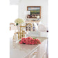 Kitchen counter with pink roses and Kingston Brass KS1272ALBS polished brass fixtures with framed picture in background