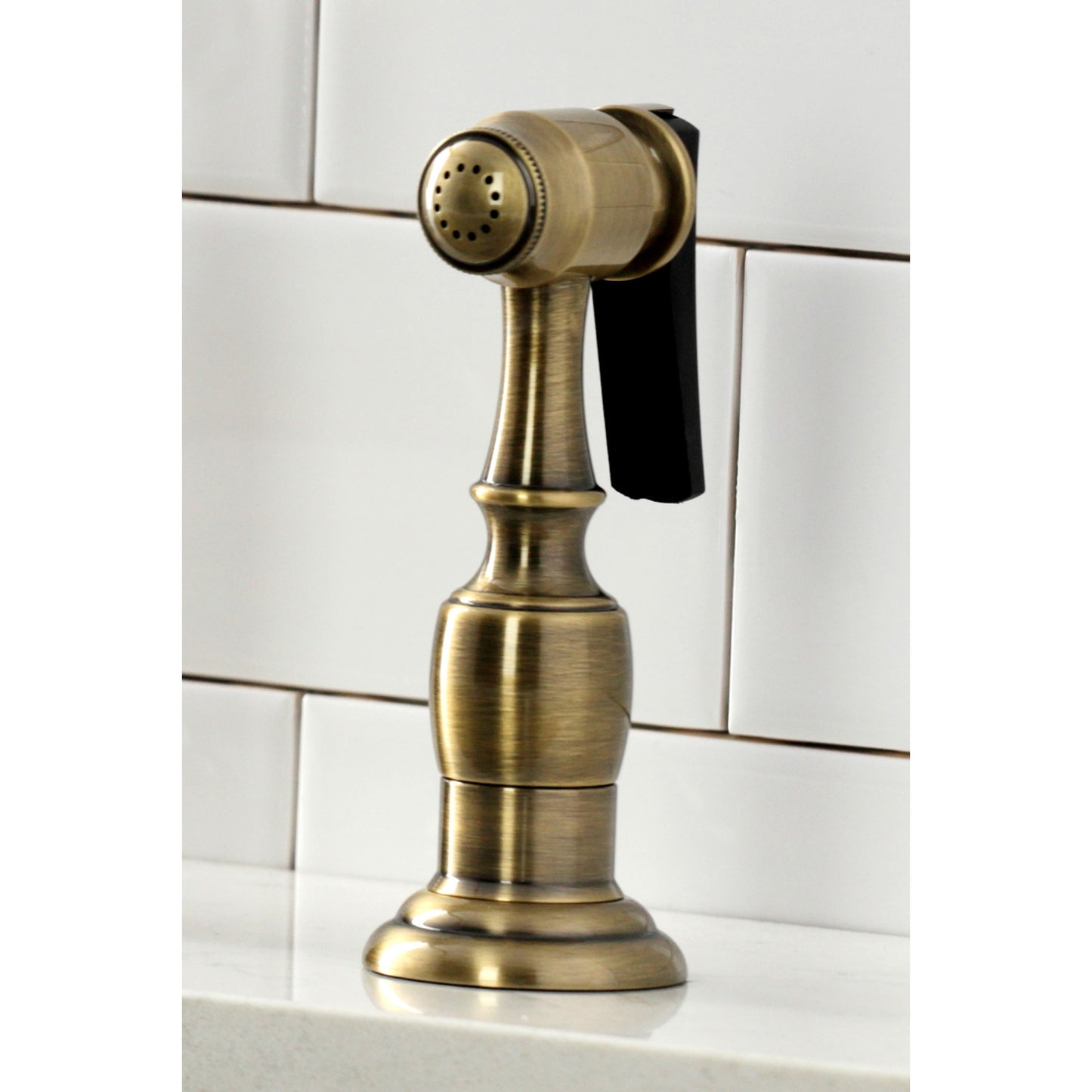 Close-up view of the KINGSTON Brass Heritage Bridge Kitchen Faucet with Brass Sprayer, showcasing elegant design and functionality.